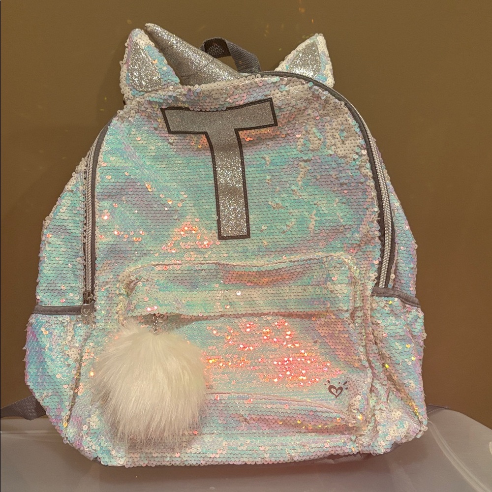 Iridescent Sequin Backpack with Pom Pom justice brand brand new